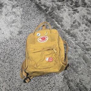 Fjall Raven Womens Kanken Mini Backpack in Warm Yellow Size OS